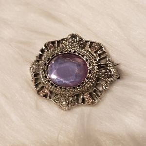 Silver brooch with lavender stone